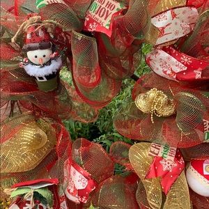 Holiday wreath in red, green and gold.